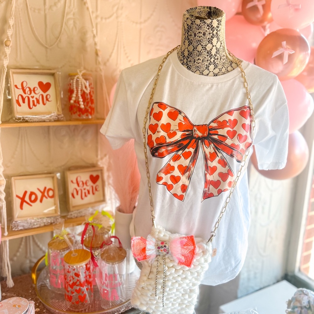 “Oversized White Tee with Statement Bow – Chic & Playful Style!”